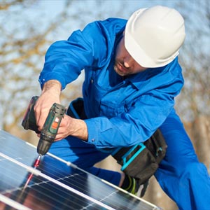 advantage-solar-photo-of-a-man-repairing-the-solar-panels-in-the-roof-of-a-house